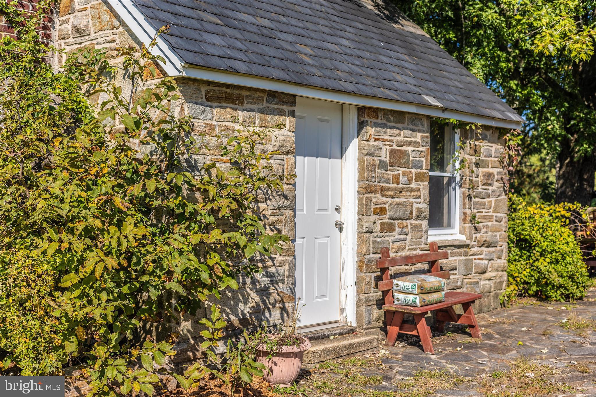1021 Saffell Road Reisterstown, MD 21136 - Photo 13 of 57 a backyard of a house with table and chairs
