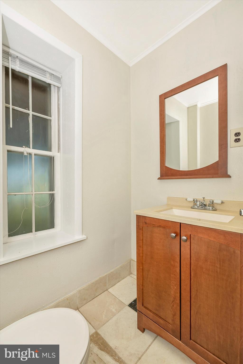 1021 Saffell Road Reisterstown, MD 21136 - Photo 45 of 57 a bathroom with a toilet a sink and mirror