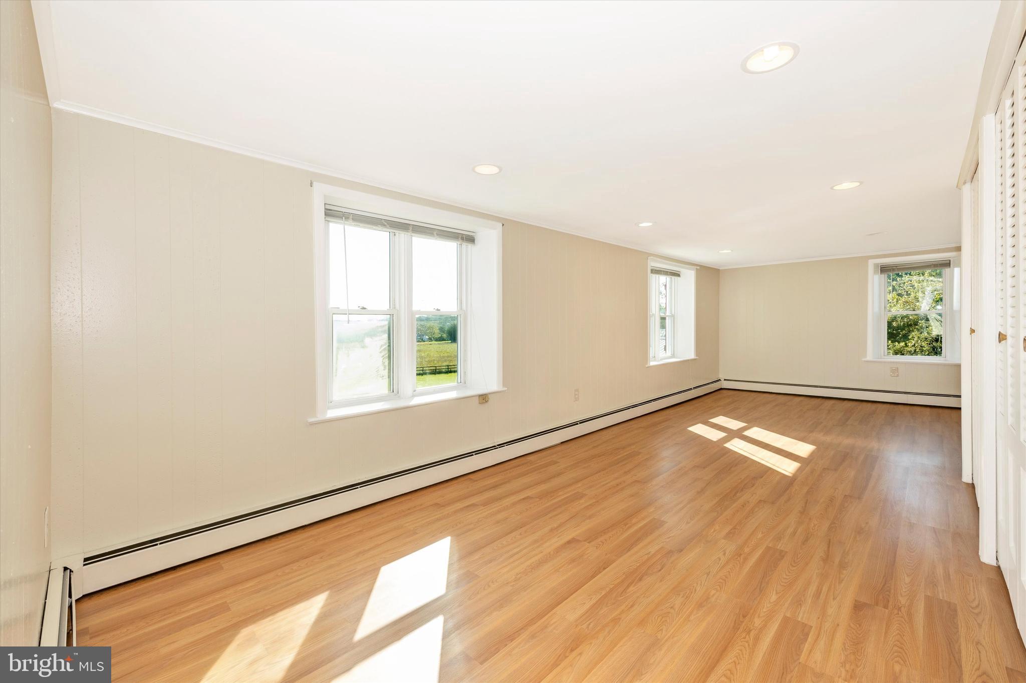 1021 Saffell Road Reisterstown, MD 21136 - Photo 46 of 57 a view of empty room with wooden floor and fan
