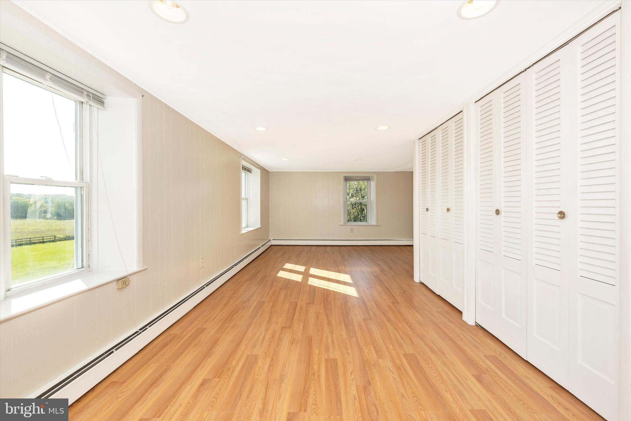 1021 Saffell Road Reisterstown, MD 21136 - Photo 47 of 57 a view of empty room with wooden floor and fan