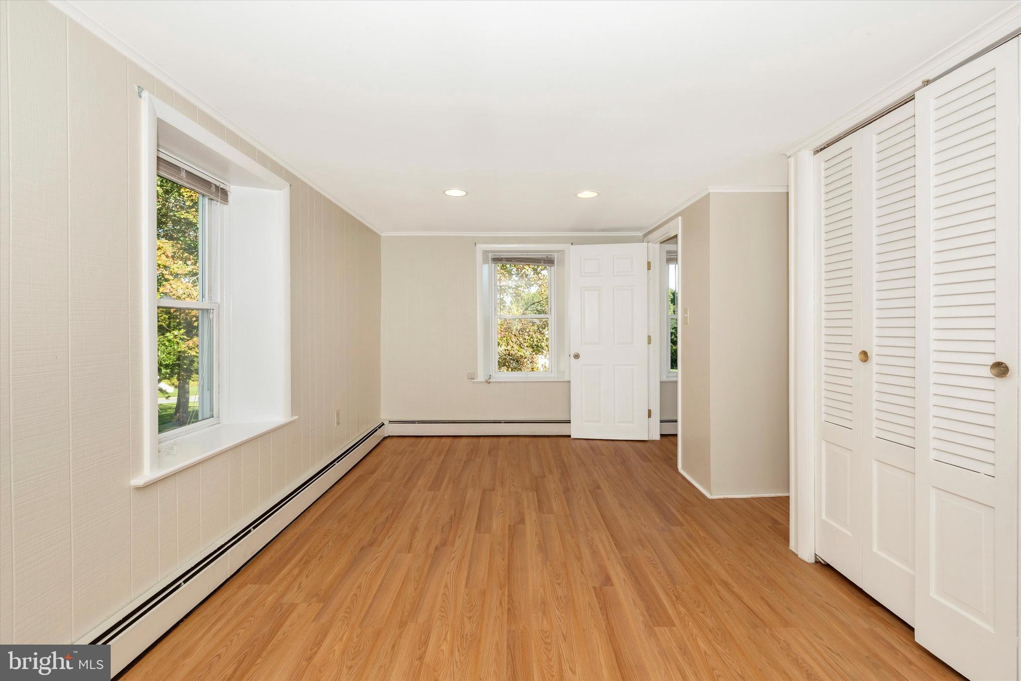 1021 Saffell Road Reisterstown, MD 21136 - Photo 55 of 57 an empty room with wooden floor and windows