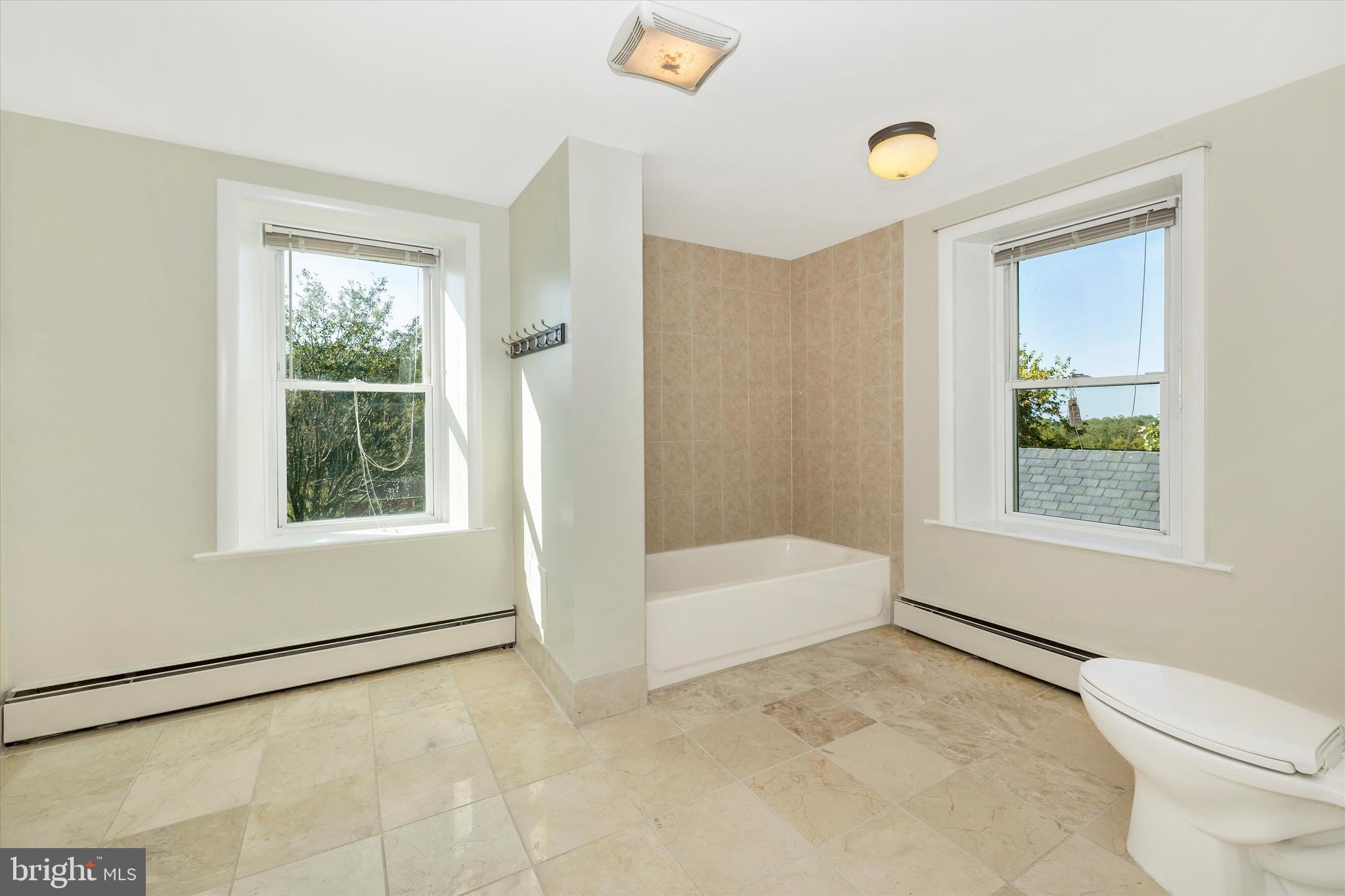 1021 Saffell Road Reisterstown, MD 21136 - Photo 57 of 57 a bathroom with a bathtub and a shower