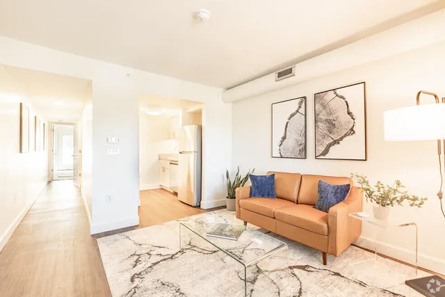 a spacious bedroom with a bed and couch