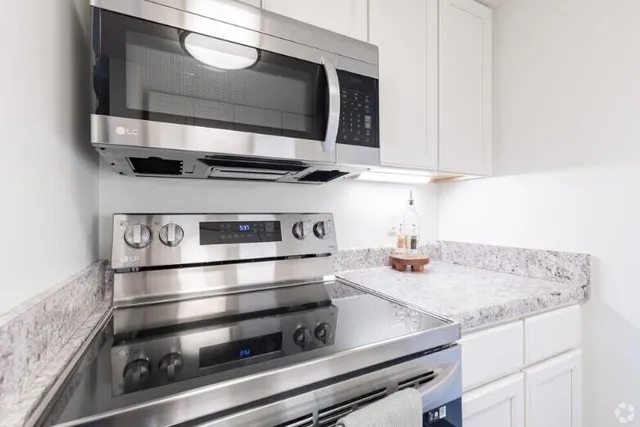 a kitchen with a stove and a microwave
