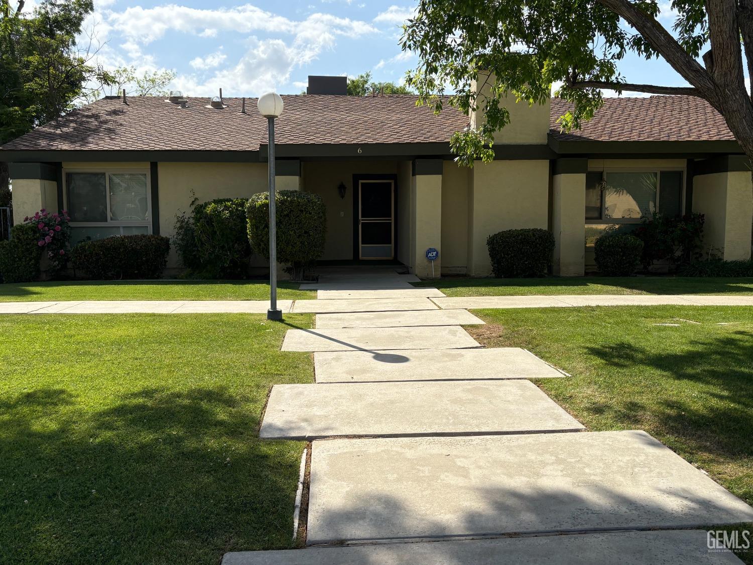a house with garden in front of it