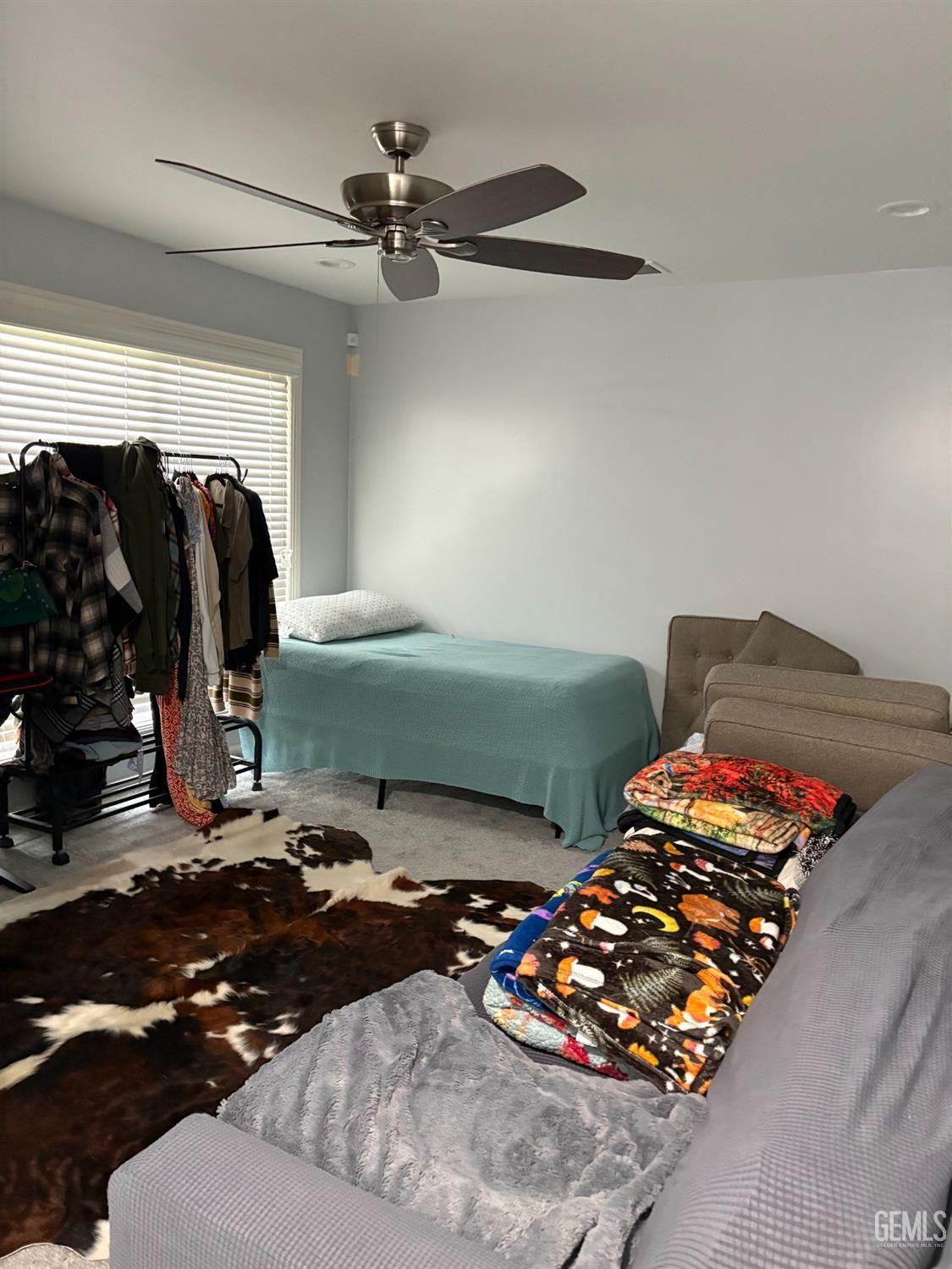 Undisclosed Address Delano, CA 93215 - Photo 14 of 23 a bedroom with bed and a mirror