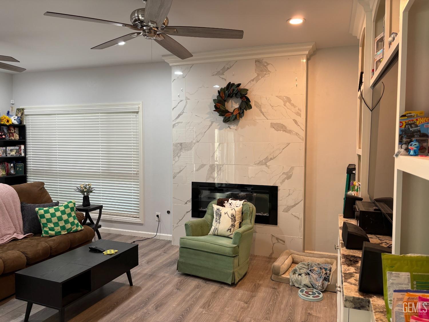 Undisclosed Address Delano, CA 93215 - Photo 2 of 23 a living room with furniture and a fireplace