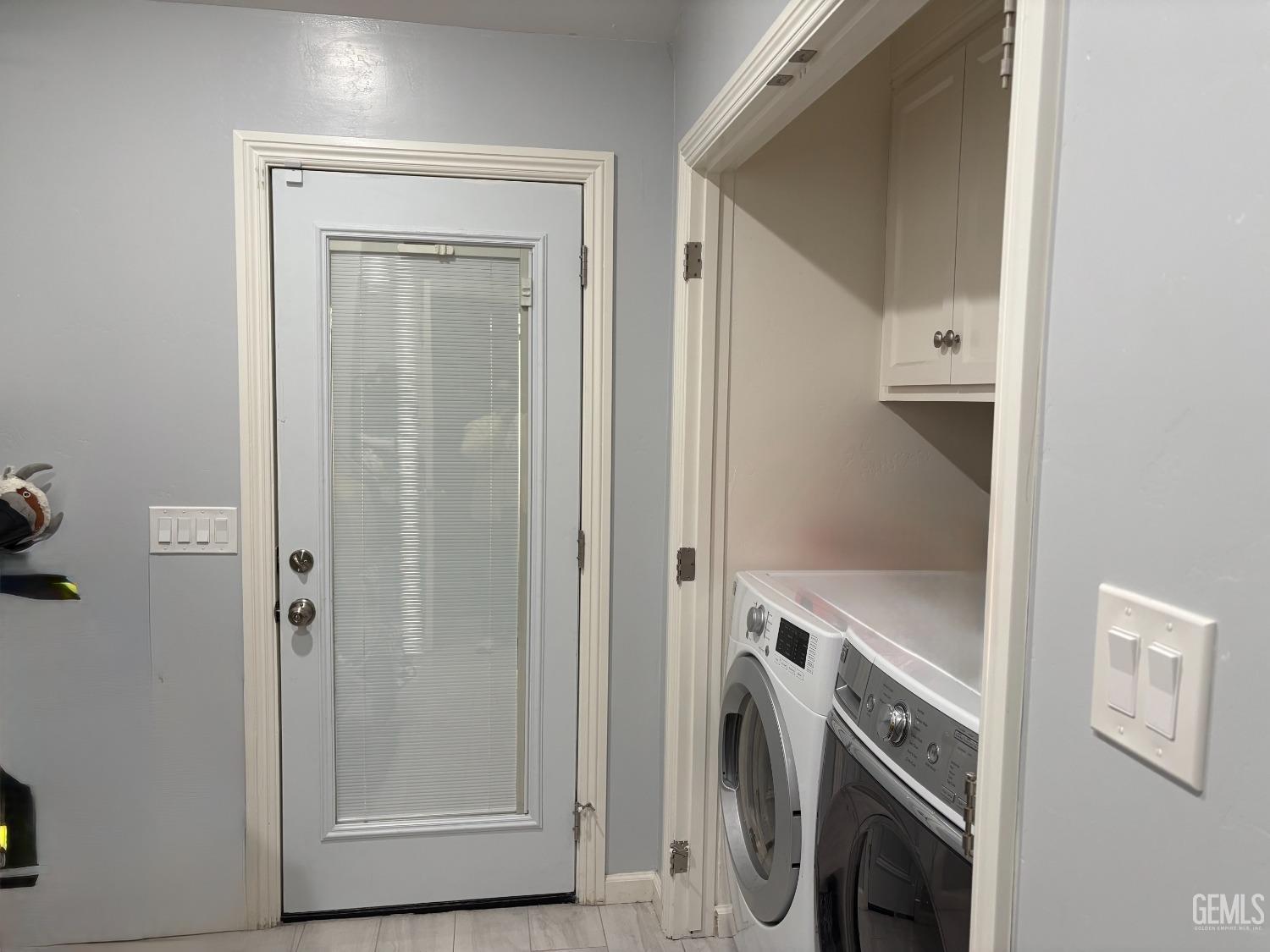 Undisclosed Address Delano, CA 93215 - Photo 6 of 23 a view of a storage and utility room with washer and dryer