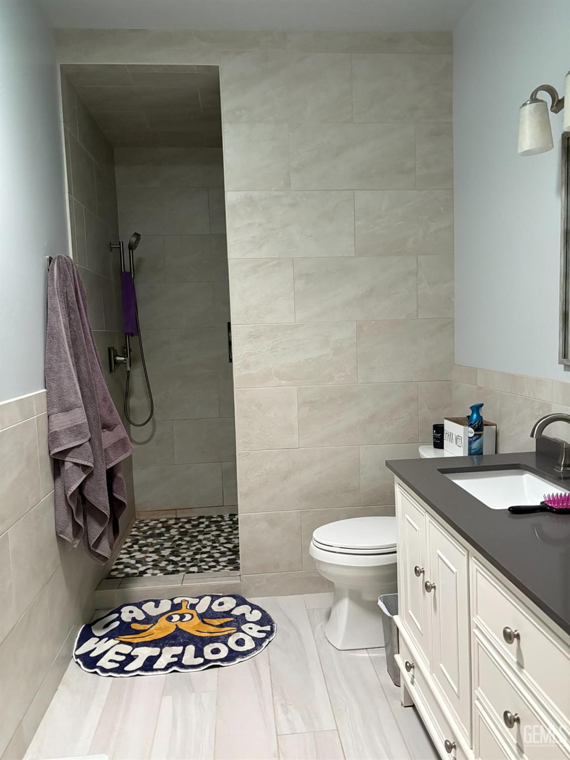 Undisclosed Address Delano, CA 93215 - Photo 10 of 23 a bathroom with a sink a toilet and a mirror