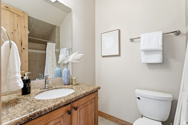 3026 Lower Saddleback Road Park City, UT 84098 - Photo 41 of 71 Bathroom with vanity and a shower with shower curtain