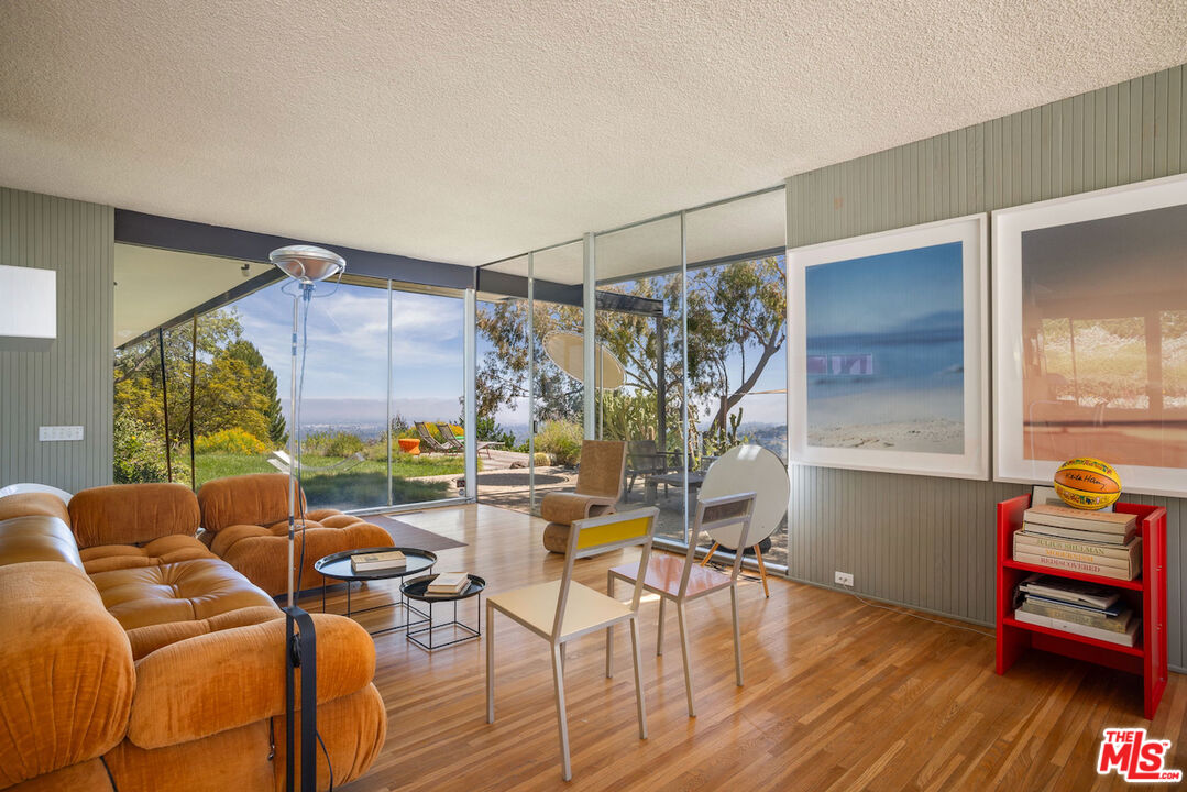1531 North Tigertail Road Los Angeles, CA 90049 - Photo 16 of 24 a living room with furniture and wooden floor