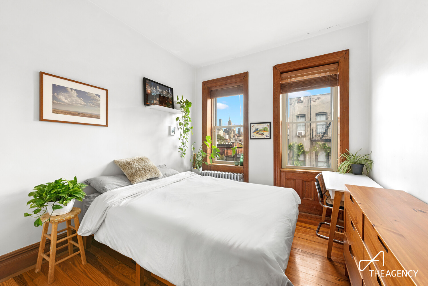 a bedroom with a bed and a table