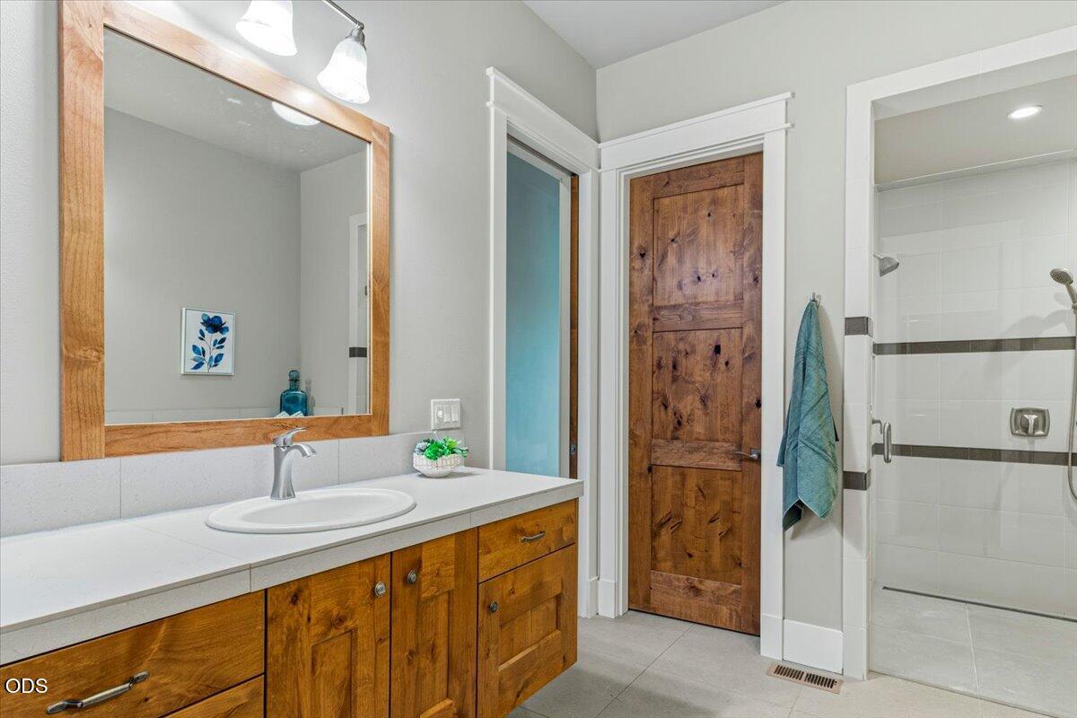 61333 Kindle Rock Loop Bend, OR 97702 - Photo 34 of 53 a bathroom with a sink and a mirror