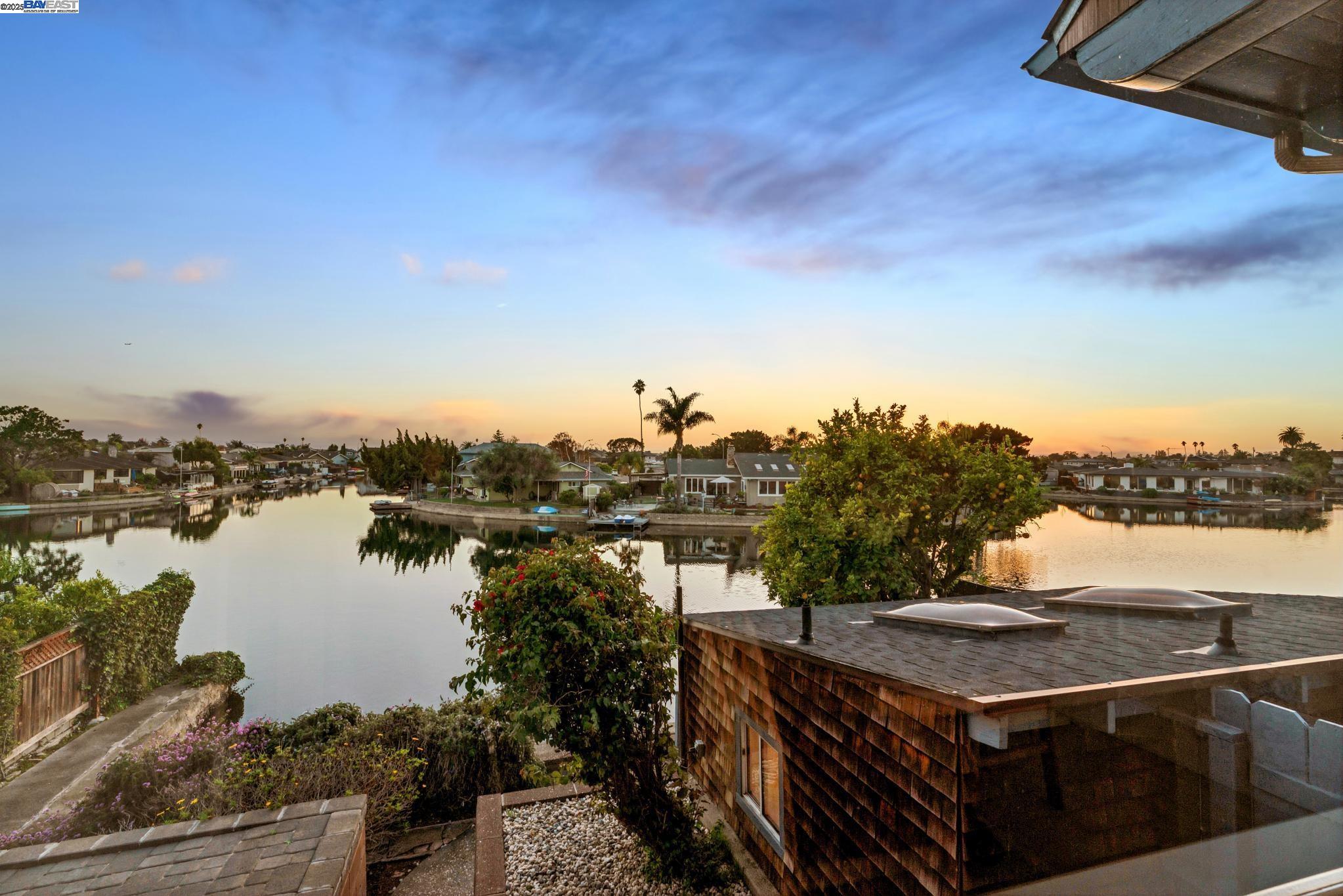 a view of a lake with a city skyline in the background