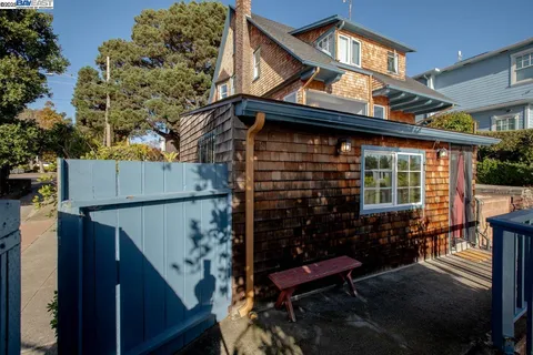 a bedroom with a large bed and a large window