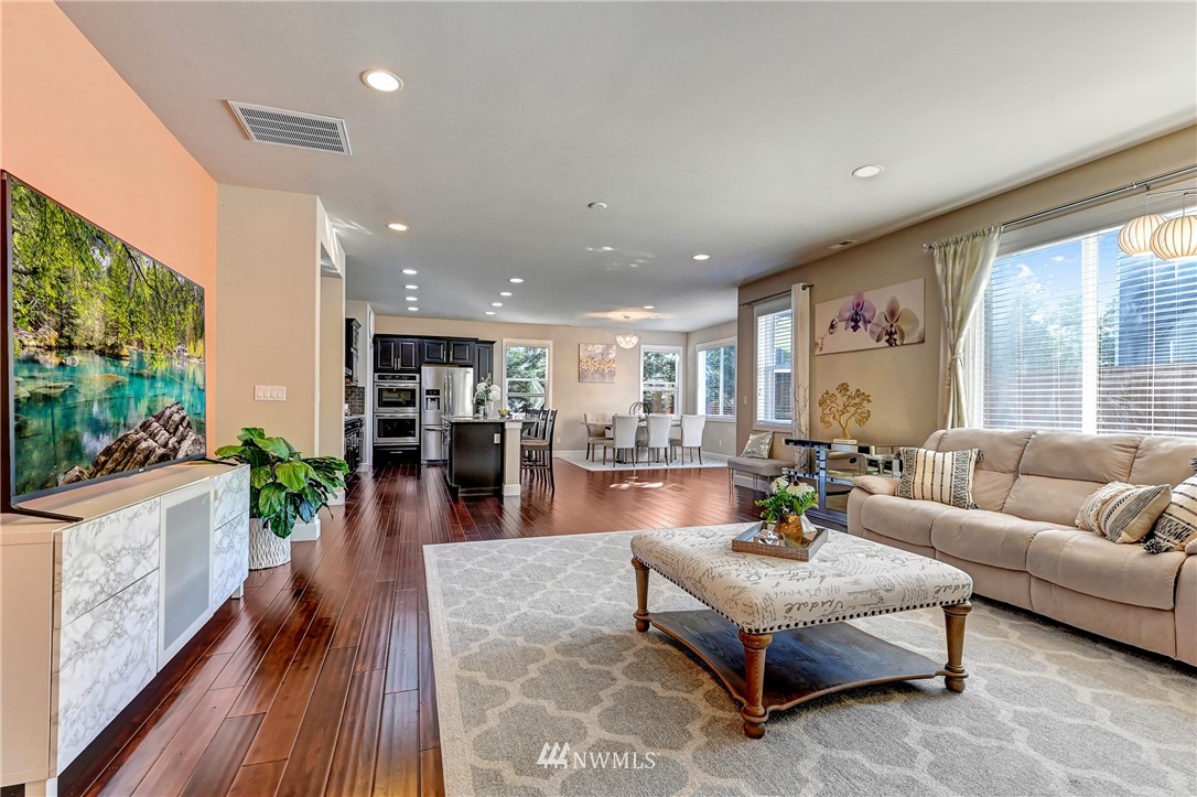 3228 170th Place Southeast Bothell, WA 98012 - Photo 11 of 40 a living room with furniture and a large window