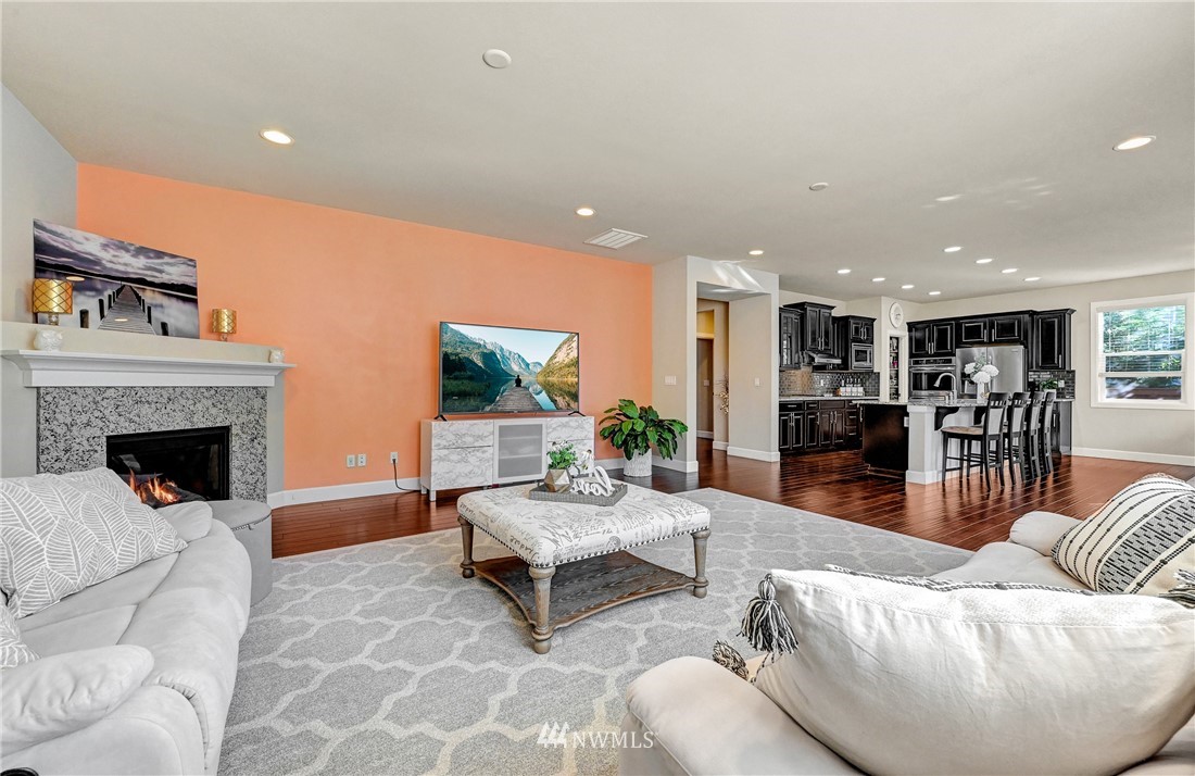 3228 170th Place Southeast Bothell, WA 98012 - Photo 12 of 40 a living room with furniture and a fireplace