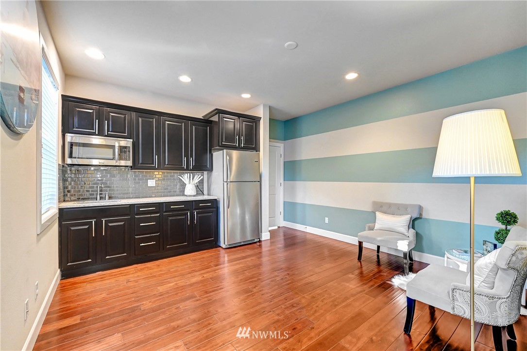 3228 170th Place Southeast Bothell, WA 98012 - Photo 15 of 40 a kitchen with stainless steel appliances granite countertop a refrigerator and a stove top oven
