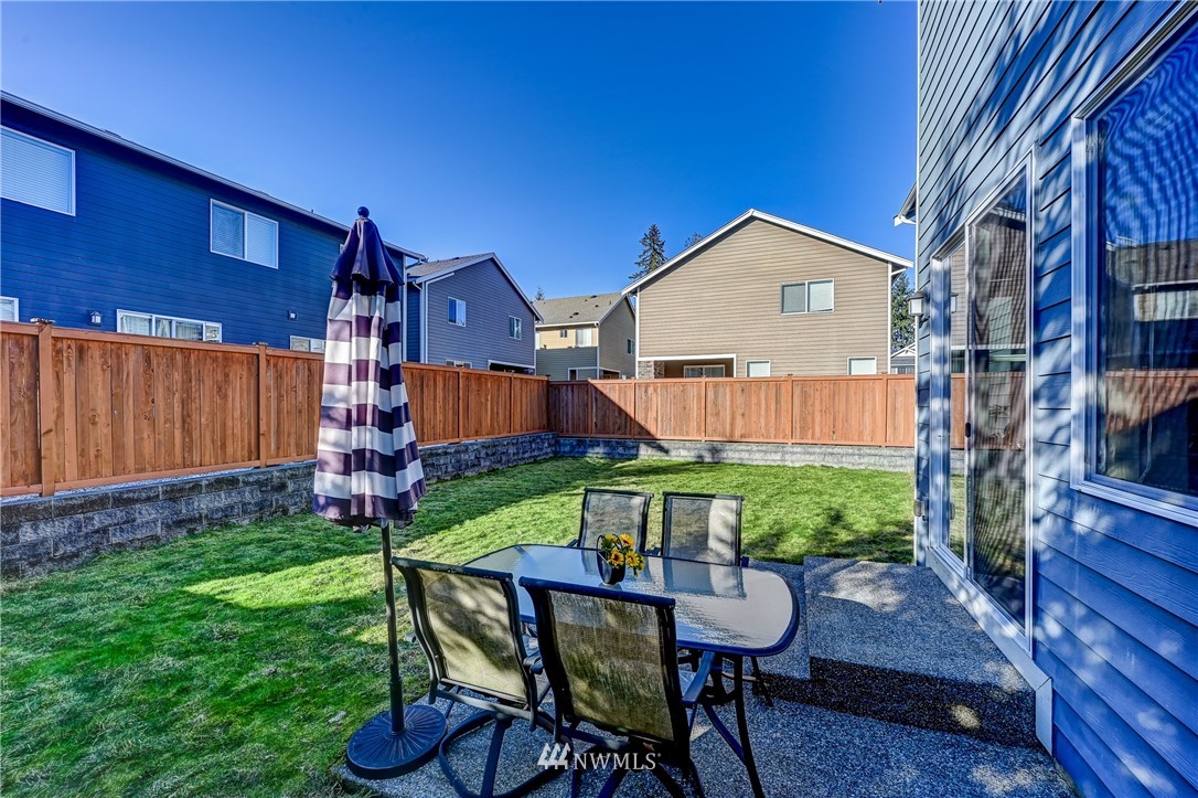 3228 170th Place Southeast Bothell, WA 98012 - Photo 18 of 40 a front view of a house with garden and porch
