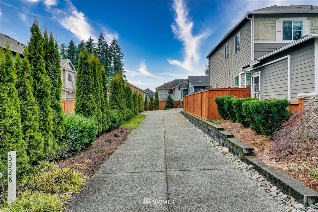 3228 170th Place Southeast Bothell, WA 98012 - Photo 20 of 40 a front view of a house with garden