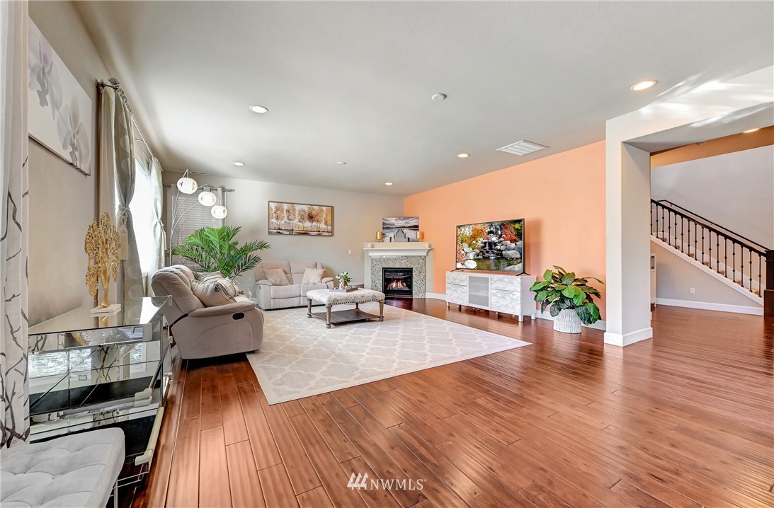 3228 170th Place Southeast Bothell, WA 98012 - Photo 26 of 40 a living room with furniture and a wooden floor