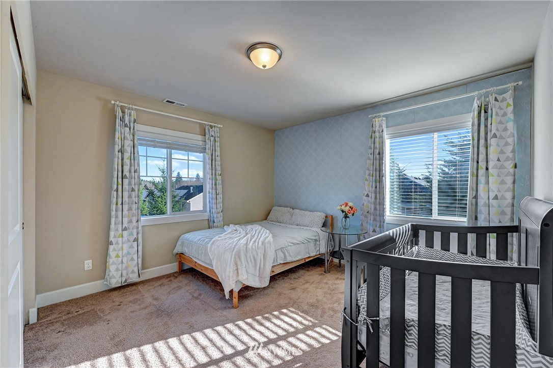 3228 170th Place Southeast Bothell, WA 98012 - Photo 30 of 40 a bedroom with two beds and a window