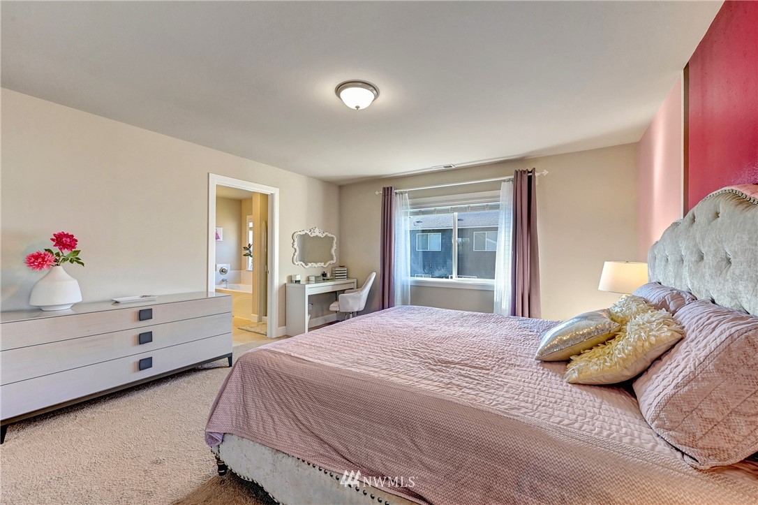 3228 170th Place Southeast Bothell, WA 98012 - Photo 31 of 40 a bedroom with a bed and a window