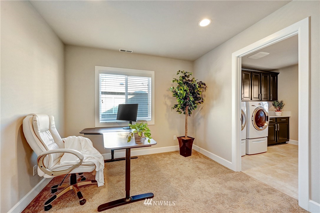 3228 170th Place Southeast Bothell, WA 98012 - Photo 34 of 40 a workspace with furniture and a gate