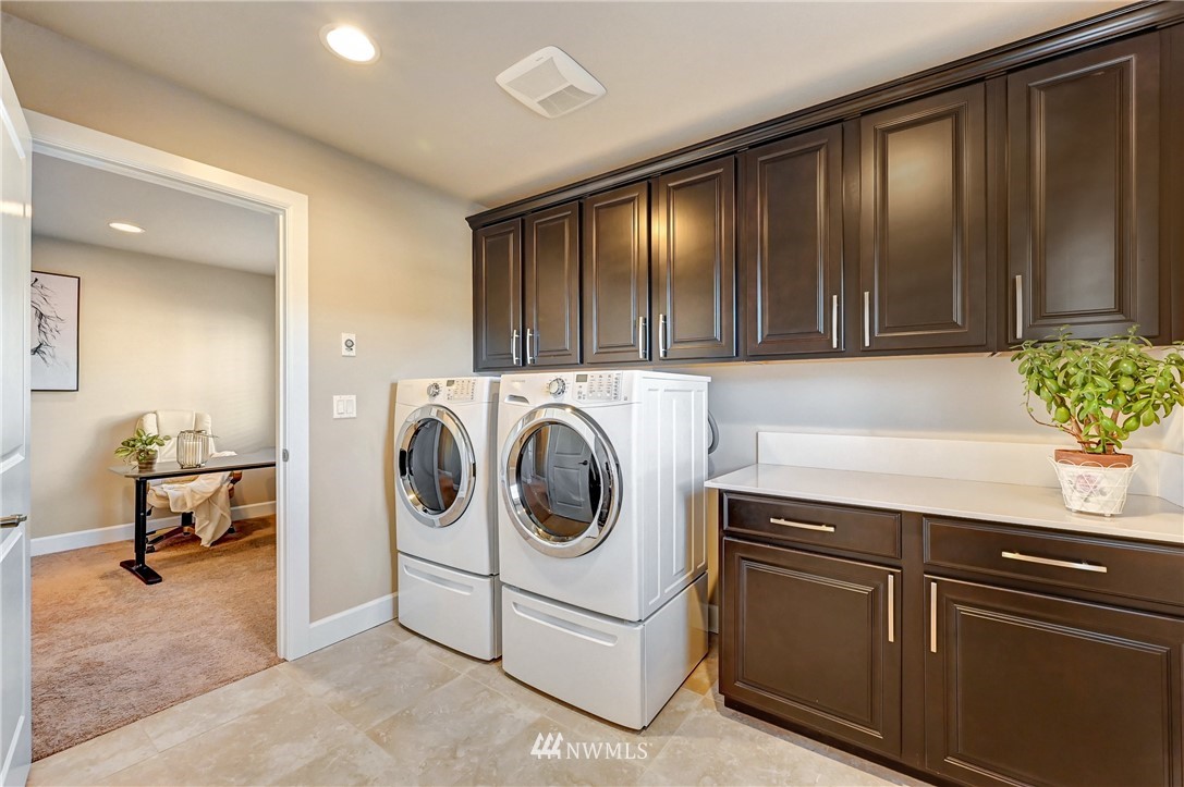 3228 170th Place Southeast Bothell, WA 98012 - Photo 35 of 40 a utility room with sink dryer and washer