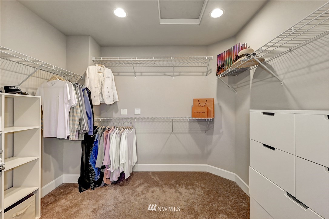3228 170th Place Southeast Bothell, WA 98012 - Photo 36 of 40 a view of walk in closet with clothes and shoes