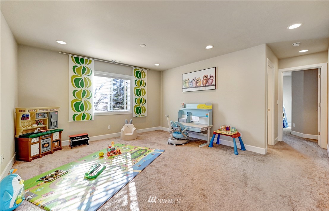 3228 170th Place Southeast Bothell, WA 98012 - Photo 38 of 40 a living room with furniture and a window