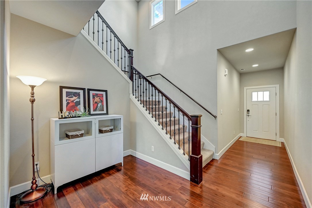 3228 170th Place Southeast Bothell, WA 98012 - Photo 4 of 40 a view of entryway and hall with wooden floor