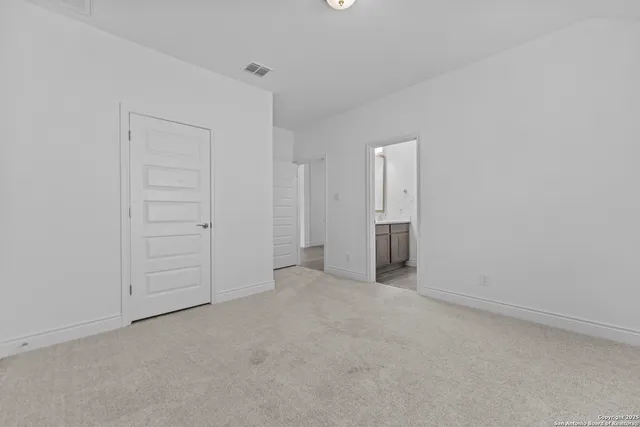 a view of an empty room and closet