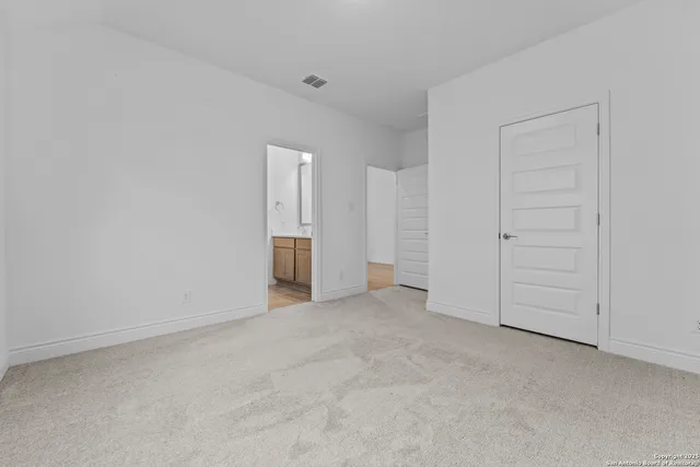 a view of an empty room and entryway