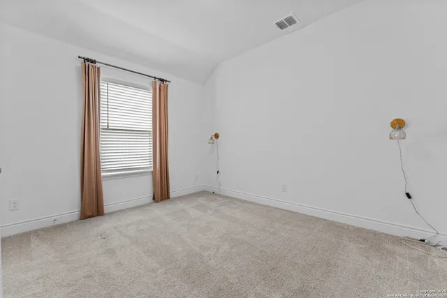 a view of a room that has a window in it