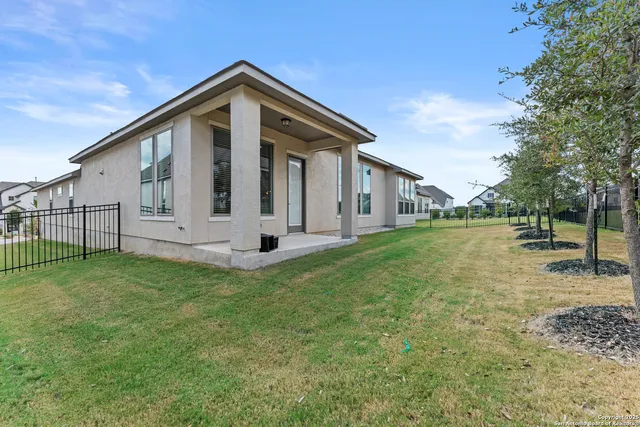a front view of house with yard and green space