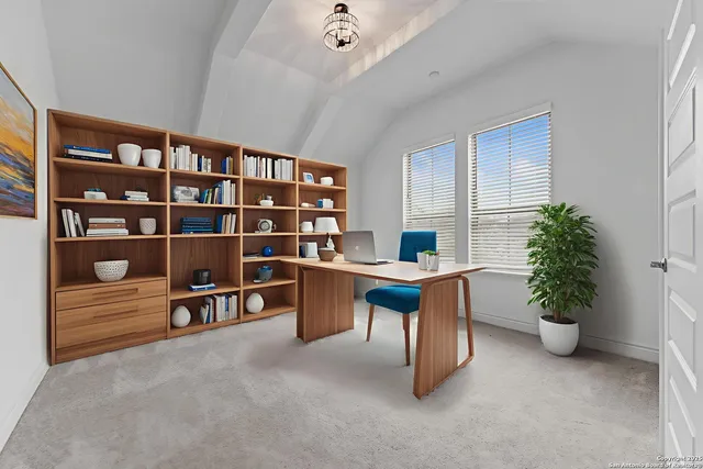 a view of a workspace with furniture