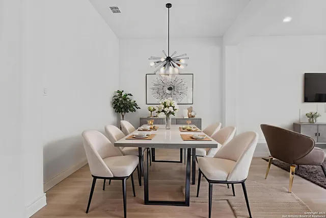 a dining room with furniture and window