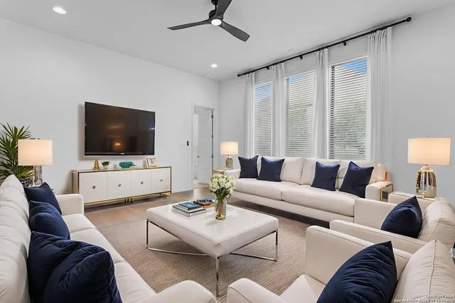 a living room with furniture and a flat screen tv