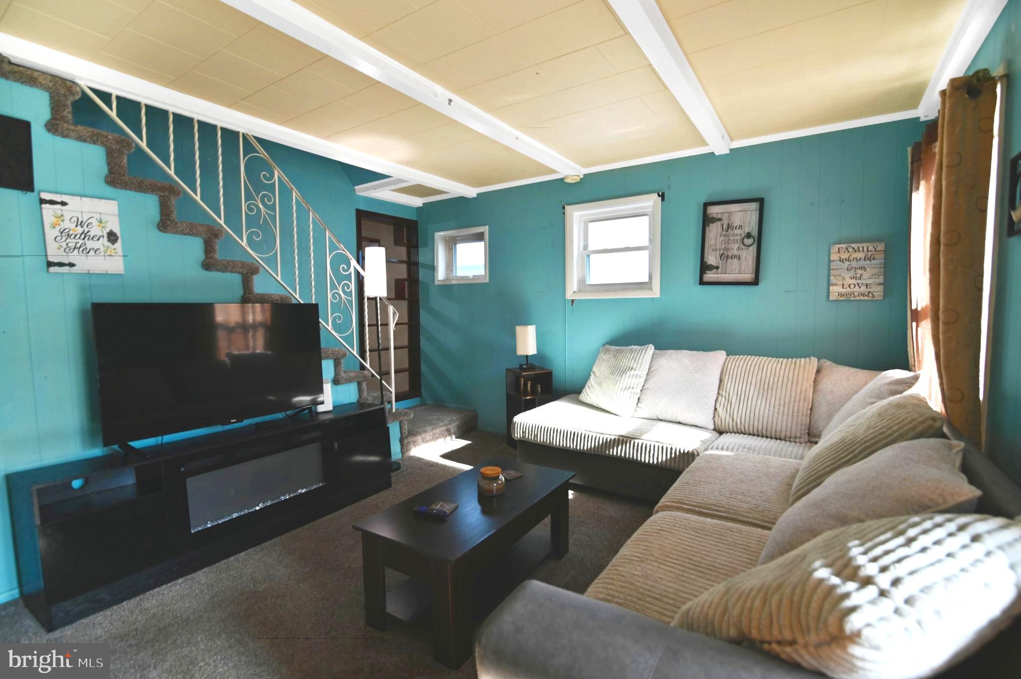 215 Haakon Road Brooklawn, NJ 08030 - Photo 7 of 20 a living room with furniture and a flat screen tv