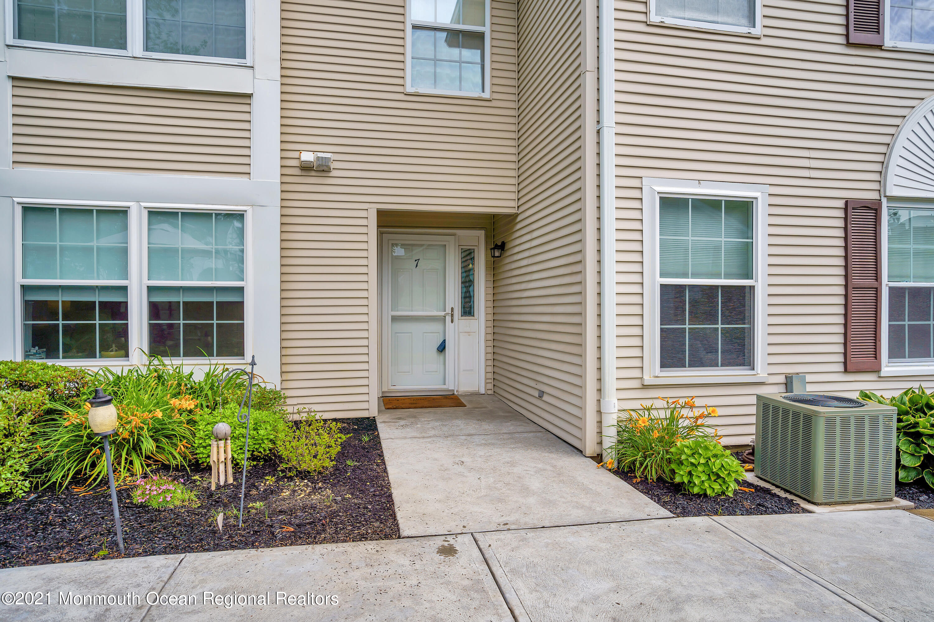 7 Racquet Road Wall, NJ 07719 - Photo 4 of 28 a front view of a house with garden