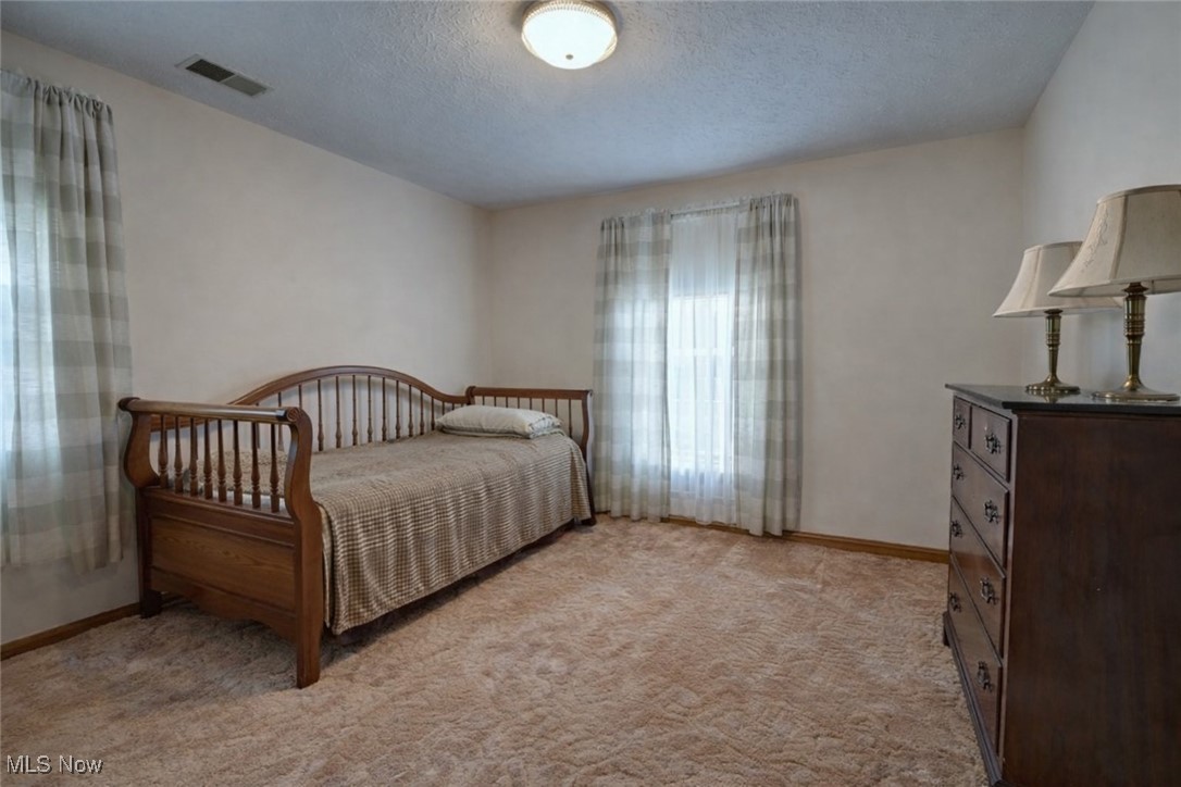 14965 Seacrist Road Salem, OH 44460 - Photo 17 of 43 Bedroom with a textured ceiling and light carpet