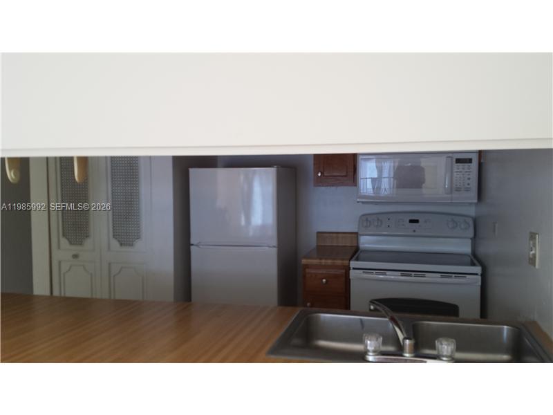 3720 Inverrary Drive, Unit 2M Lauderhill, FL 33319 - Photo 9 of 11 Kitchen