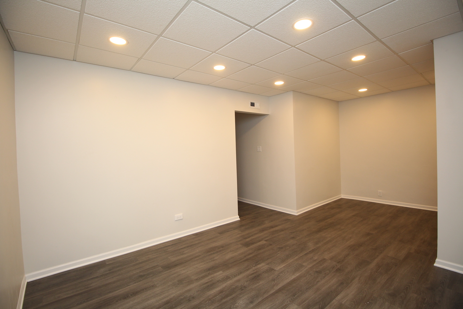 120 North Spring Street, Unit 1 Elgin, IL 60120 - Photo 8 of 12 a view of hallway with wooden floor
