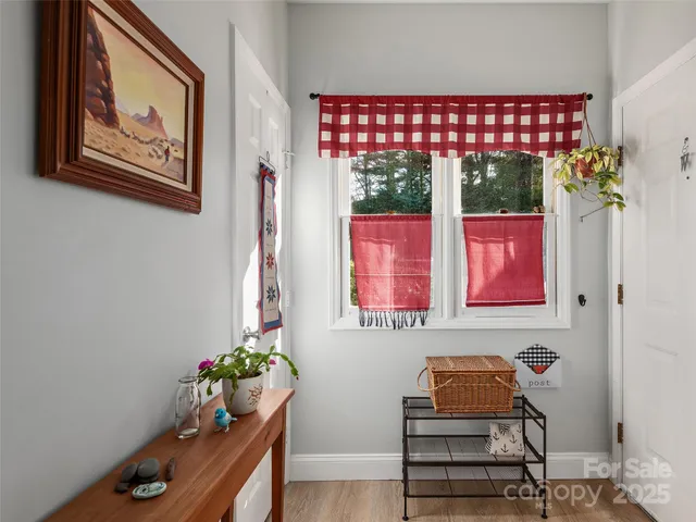 a room with furniture and flower vase