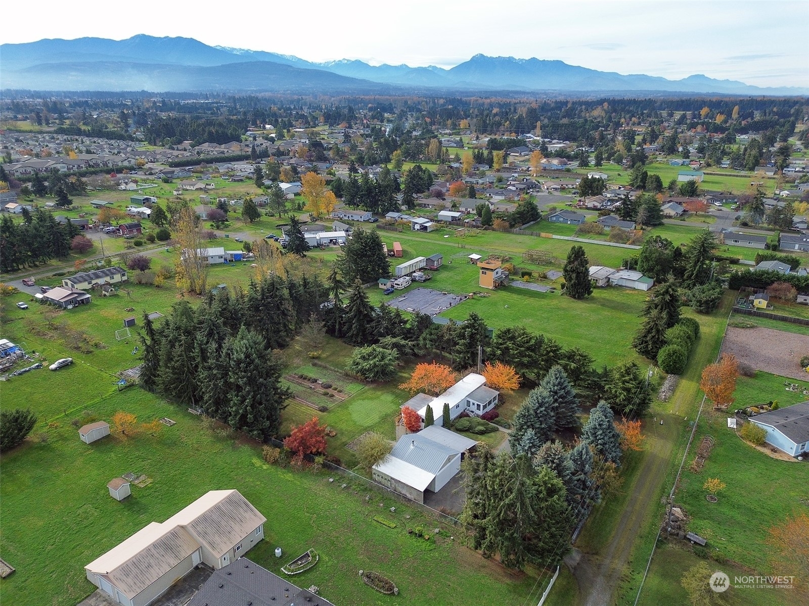 241 Evans Road Sequim, WA 98382 - Photo 3 of 40 a view of a house with a garden