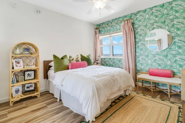 a bed sitting in a bedroom next to a window