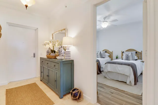 a bedroom with a bed and chandelier