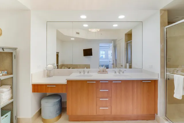 a bathroom with a sink double vanity and a mirror