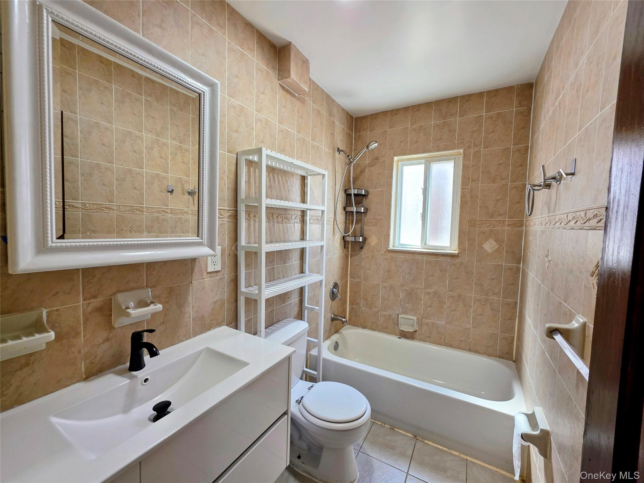 219-23 114th Road Queens, NY 11411 - Photo 8 of 9 a bathroom with a sink toilet and shower